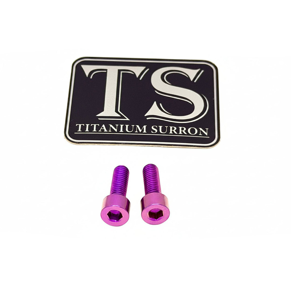 Two purple anodized titanium surron screws with a black and silver TS Titanium Surron logo patch, shown on a white background.