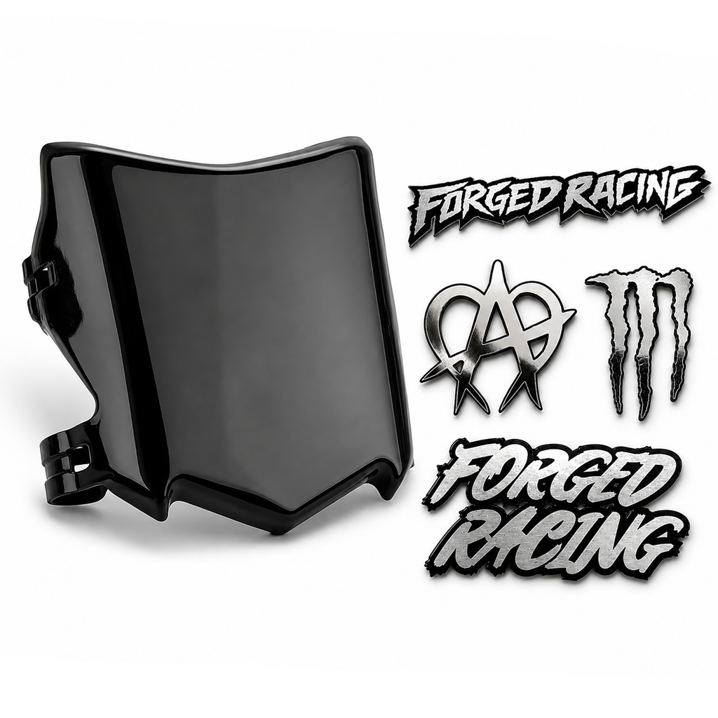 A glossy black motorcycle windshield shield shown next to several decals, including two 'FORGED RACING' logos and two Monster Energy claw logos, on a white background.