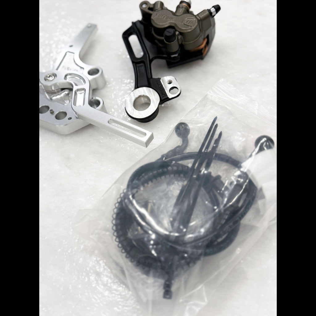 Sur-Ron and E-Ride foot brake kit with Ultra Bee calipers - close-up detail