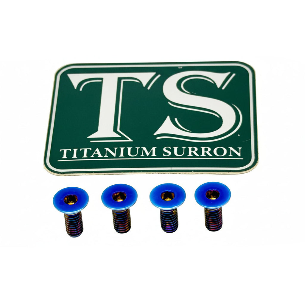 Four blue titanium surron screws with dark blue anodized threads, displayed below a green and white 'TS TITANIUM SURRON' brand plaque on a white background.