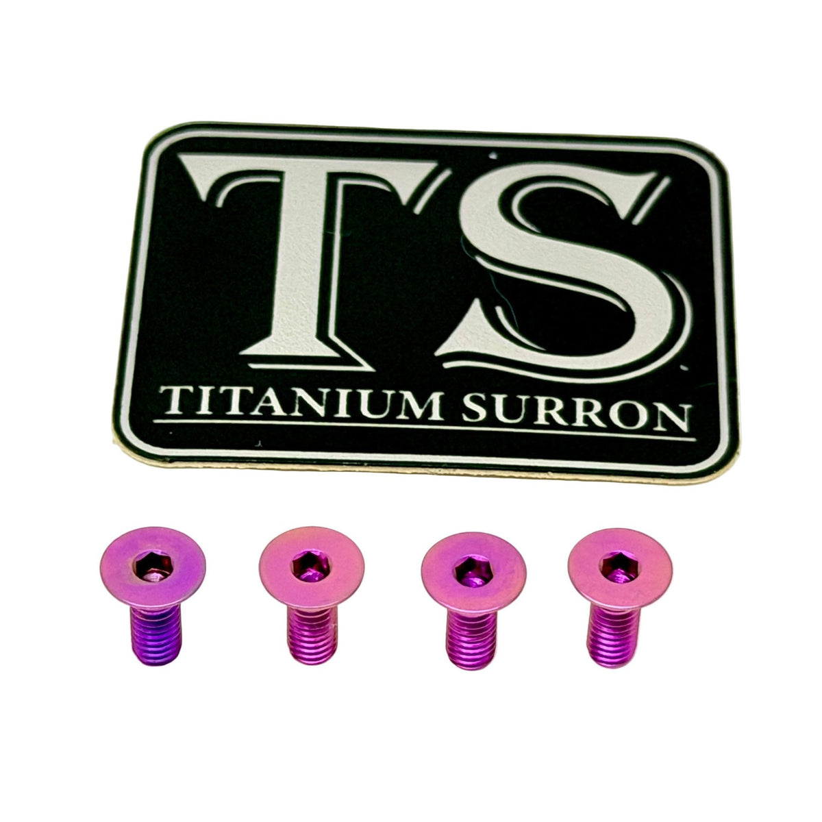 A set of four metallic pink and purple titanium surron screws displayed below a black and silver 'TS TITANIUM SURRON' logo badge, on a solid white background.