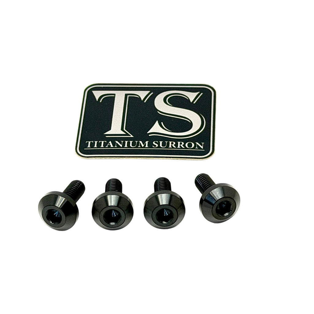 Four black titanium surron screws arranged in a row below a black and silver 'TS TITANIUM SURRON' logo badge, on a plain white background.