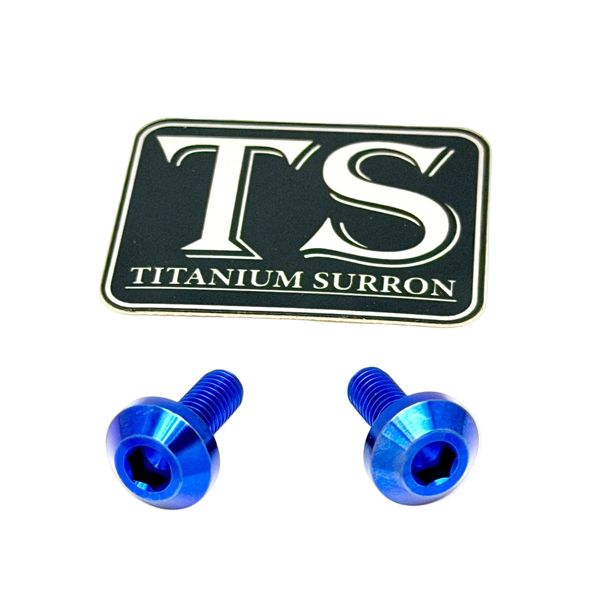 Two blue anodized metal hex screws with a black and silver 'TS TITANIUM SURRON' logo sticker, shown on a plain white background.