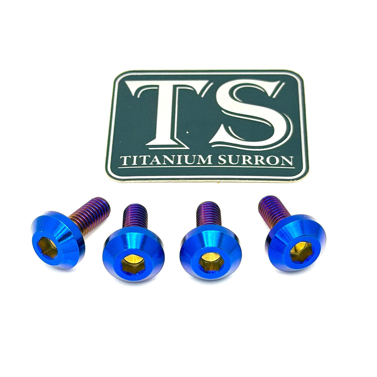 Four metallic blue hex head screws with purple anodized threads, arranged in a row below a green and white 'TS Titanium Surron' brand logo on a plain white background.