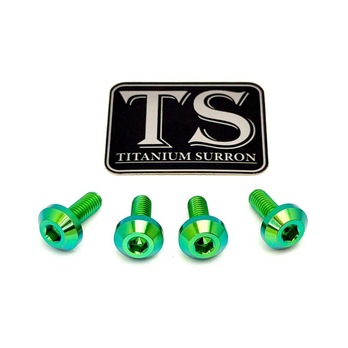 Four metallic green and blue hex screws arranged in a row below a black rectangular badge with silver 'TS' lettering and the words 'TITANIUM SURRON' on a white background.