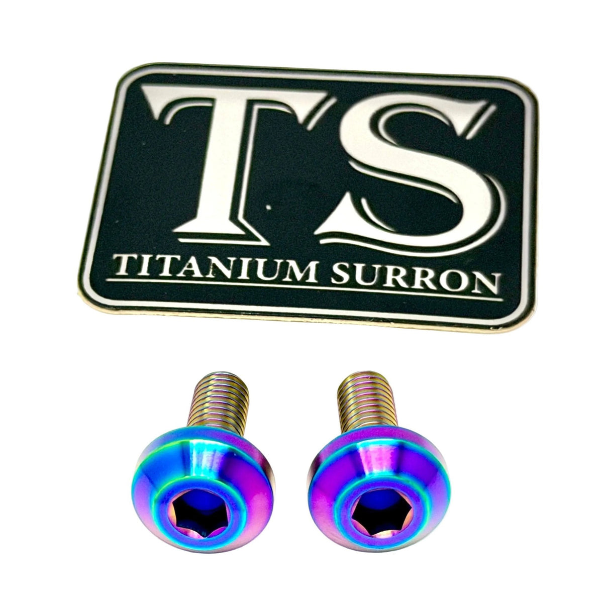Two titanium surron motorcycle screws with an iridescent purple and blue finish, shown below a black and gold 'TS Titanium Surron' brand plaque on a white background.