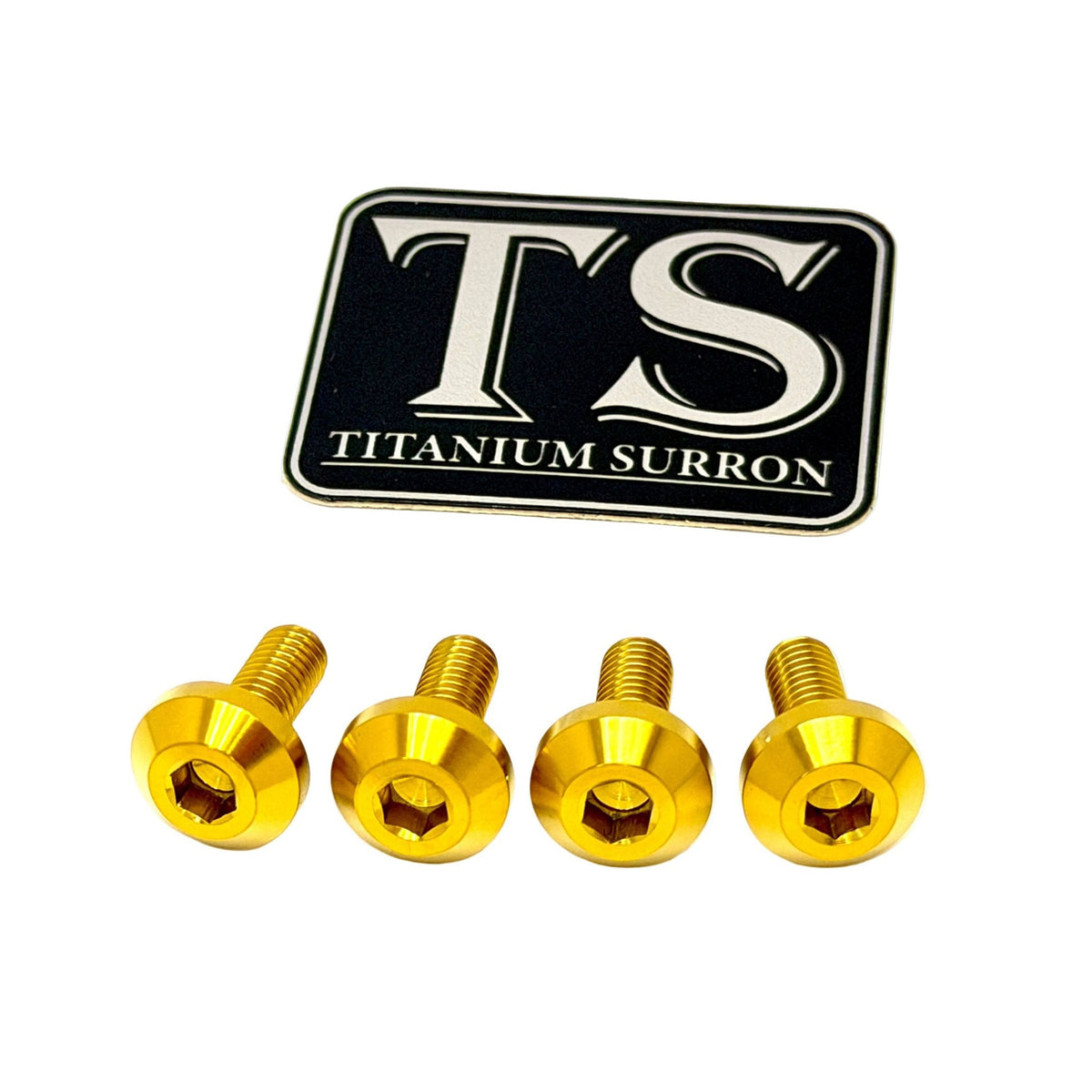 Four gold-colored titanium surron screws displayed horizontally below a black and silver 'TS TITANIUM SURRON' logo badge, set against a plain white background.
